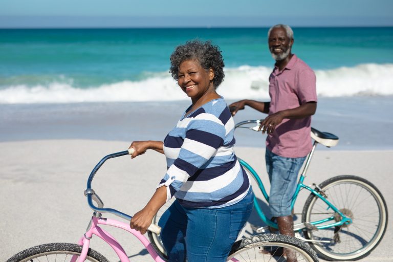 Senior African American couple standing on the beach